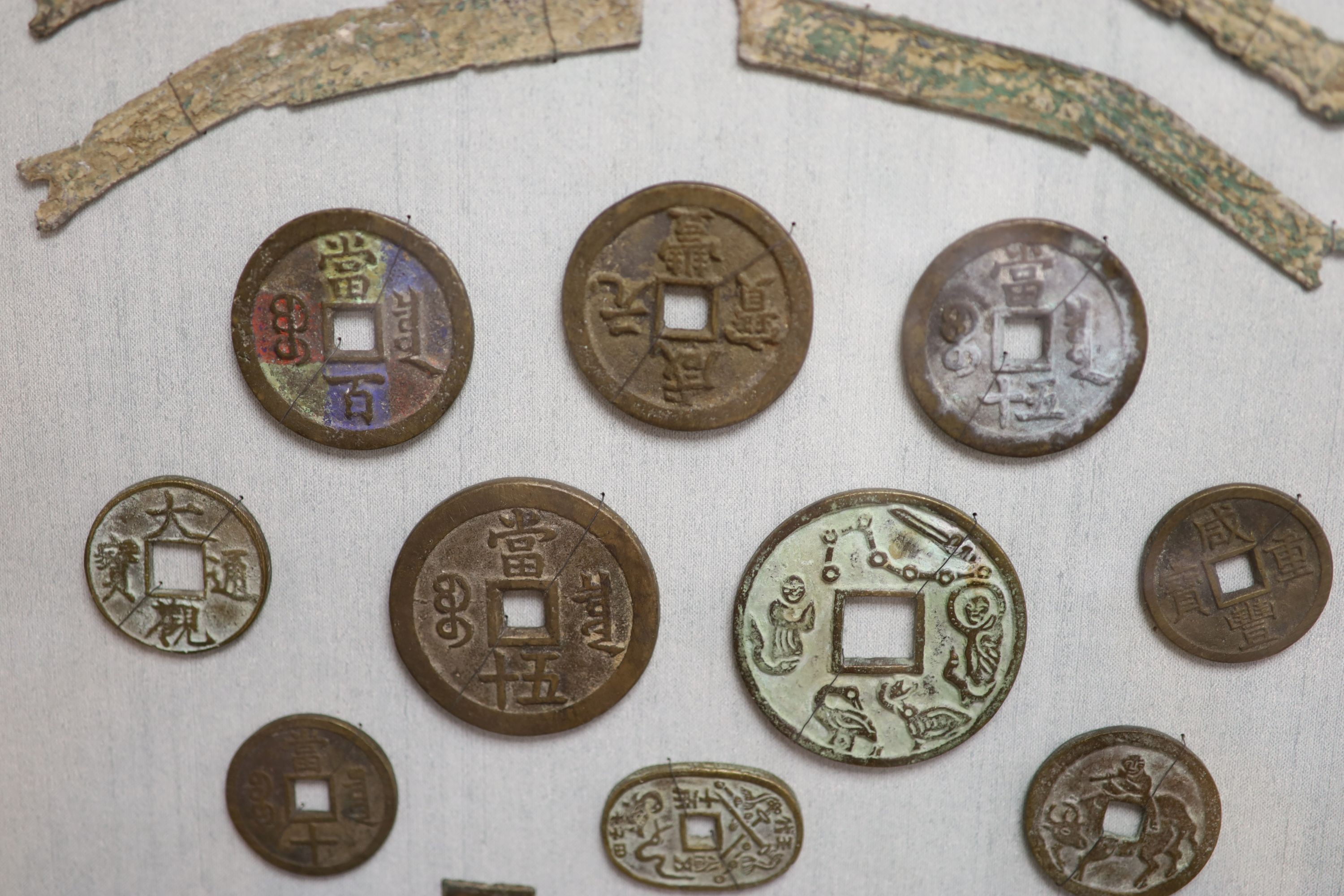 A quantity of framed Chinese coins